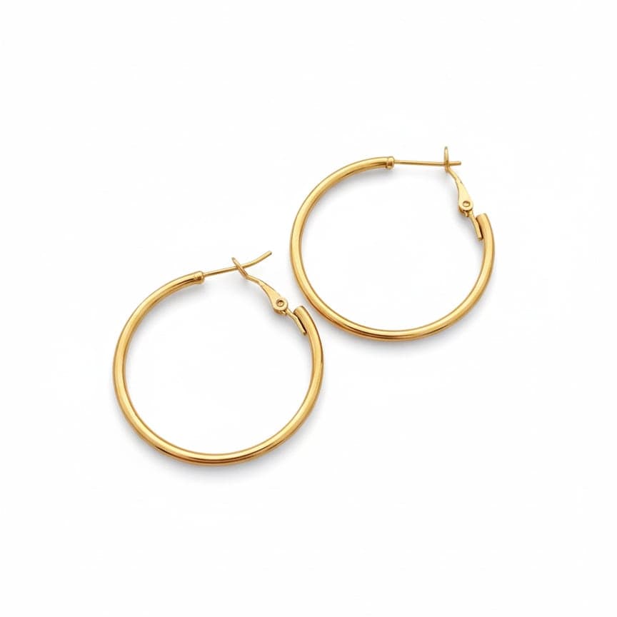 Gold tone hoop earrings on brass