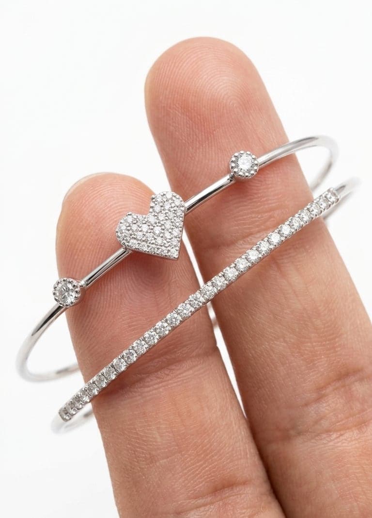 Silver-tone double bracelet with zircon stones set in a heart design on a Brass-patterned base